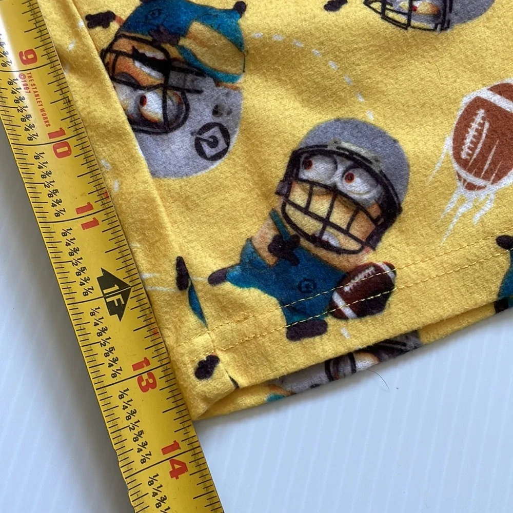 Minions yellow football pajama top & bottoms.  Size 4